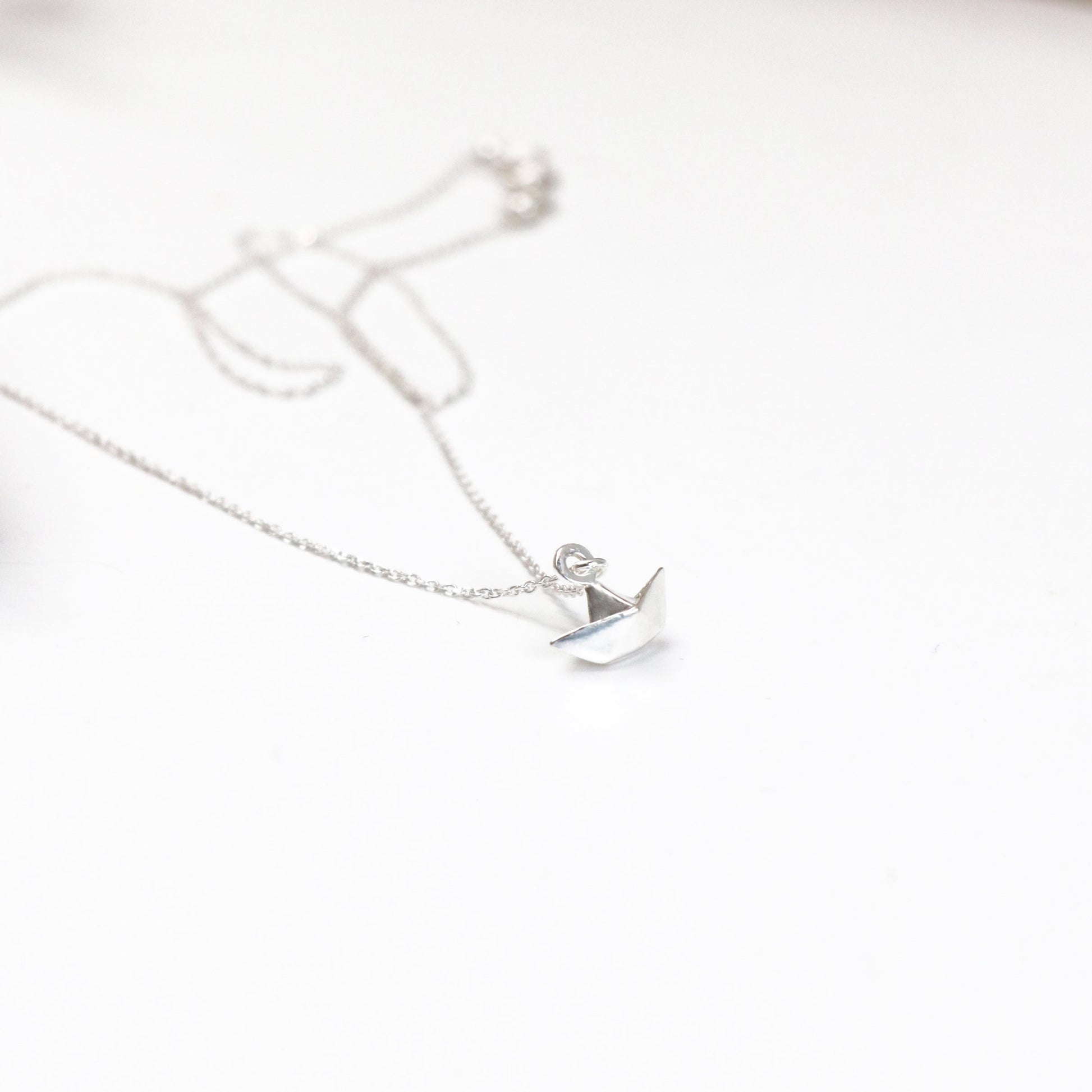 silver tiny origami boat necklace